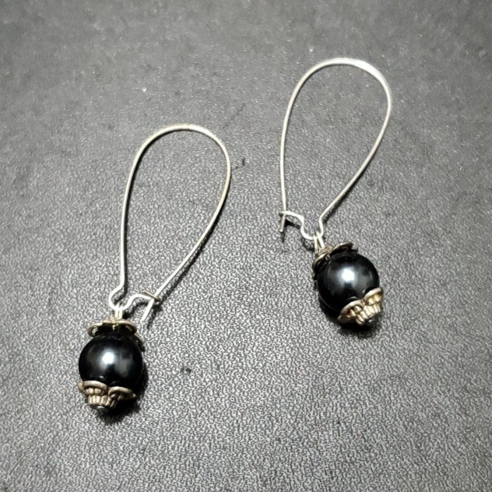 Silver tone dangling black bead earrings